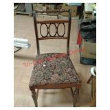 > Vintage wood chair with floral pattern