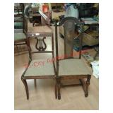 > Two vintage wooden chairs with upholstered seats