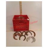 Vintage Horseshoes and plastic milk crate