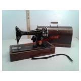 Antique portable Singer sewing machine in wood