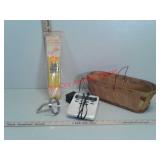 Basket with weather radio, biscuit dough cutter,