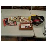 Road atlases, antique books, 1992 Olympic pin