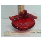 Red glass bird on nest dish