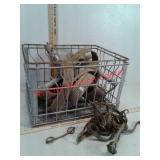 Metal milk crate, ratchet straps, horse bits and