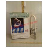 New hinged elevated toilet seat and used grab bar