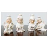 Four Japanese Porcelain Angel Candle Holders