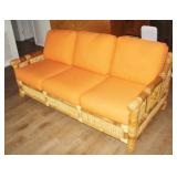 6'4' Rattan Sofa with Orange Cushions
