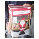 Santa Holding A Present Christmas Decor