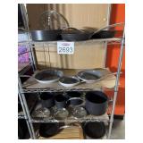 Assorted pots and pans contents on the shelf