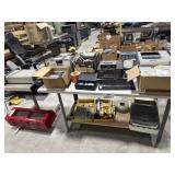 Table with mix items , tapes tools and more