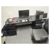 Contents of the room, one desk with two towers