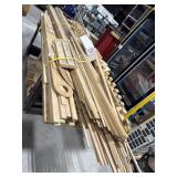 Table on casters with assorted lumber, moldings