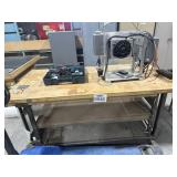 Metal work table with wooden blank on the