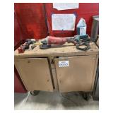 Metal cabinet including tools and accessories