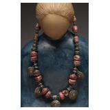 Necklace With Coiled Beads and Pink Accents