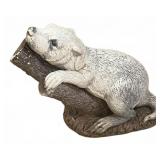 Concrete Otter Sculpture Resting on Log