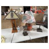 4 different styled lamps of various size