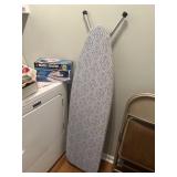 Ironing board with iron