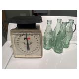 Glass Coca-Cola bottles and scale