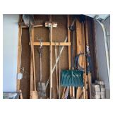 Hand tools on wall (shovels, brooms, hoes, & more)