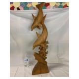 Hand carved dolphin statue