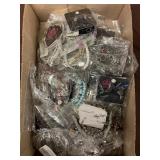 Flat of costume jewelry