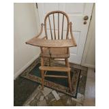 Antique high chair with leather seat
