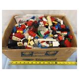12x7in box full of legos and other blocks