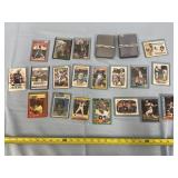 Baseball, football, & basketball card in sleeves