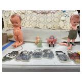 Baby doll figurines and peanuts ornaments