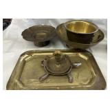 Brass bowls and plant holders candle holders and