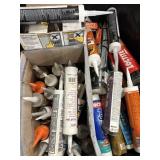 Assorted brands and types of caulk and sealants