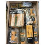 Multiple boxes of Bostitch Brad nails, a