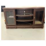 Wooden entertainment stand with glass doors