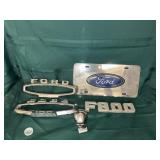 An arrangement of ford emblems and a skull