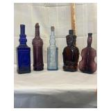 Assorted colored glass decanters