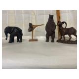 3 wooden figurines and a rubber bear