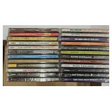 24 assorted unopened CDs