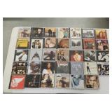 34 assorted CDs: Aerosmith,  ZZ Top, Marvin Gaye