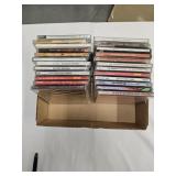 24 assorted unopened CDs