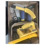 Dog tail, gauge trowels and grout folks