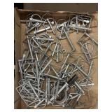 Different style hitch pins and an eye hook