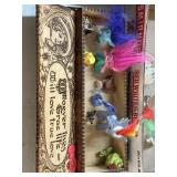 Wooden box with figurines, such as poppy branch,