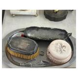 Train cufflinks and buttons, palm, brush powder,