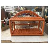 Orange two tier wicker wall shelf