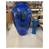 2 blue glass vases