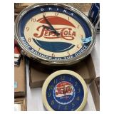 Two Pepsi clocks