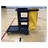 A Rubbermaid custodial cart