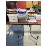 Binders, used notebooks, loose paper