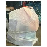 13 gallon trash bag full of Amazon basics
